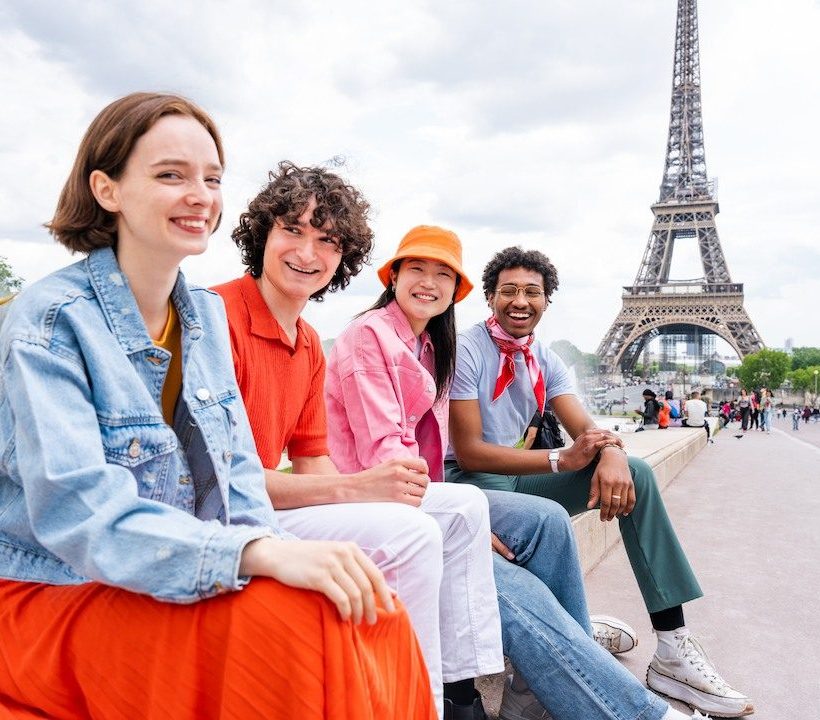 group of young happy students in paris